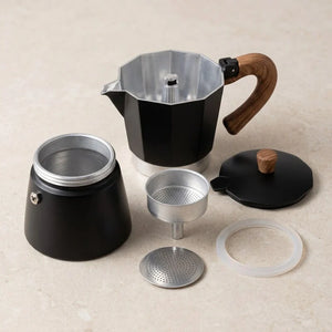 Cafeteira italiana Torino Preta desmontada com interior cinza e silicone translúcido